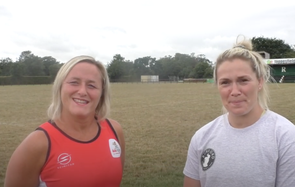 Rachael Burford and didi rugby CEO Vicky Macqueen standing in a rugby field