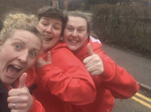 Katie Heirene, Ros Wiggins and Mollie Latham put their thumbs up and smile