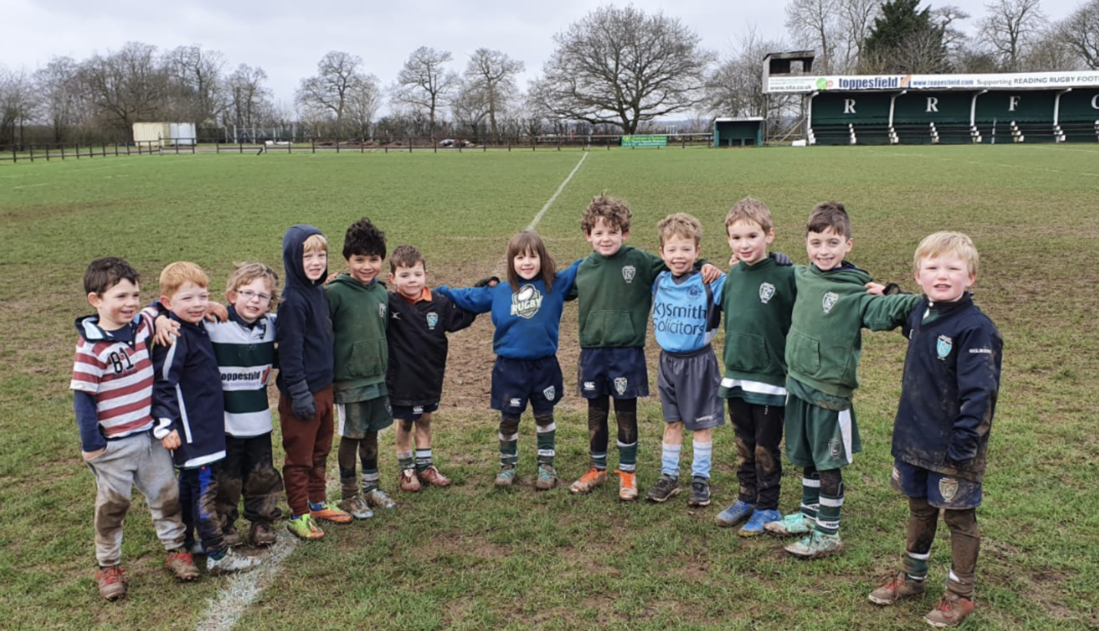 A dozen didi rugby stars in a group at Reading RFC