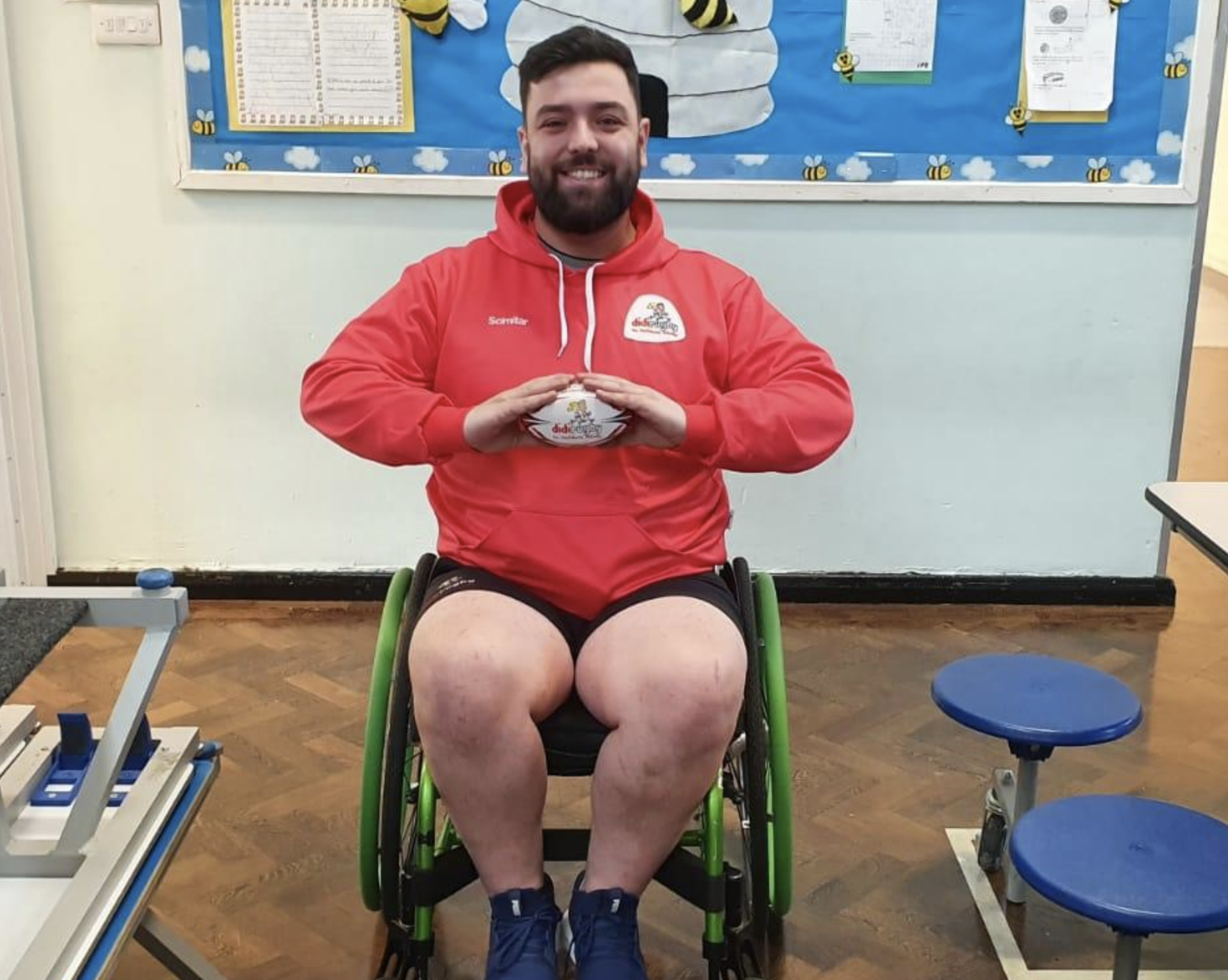 didi rugby coach Umit Akyildiz is in his wheelchair holding a didi rugby ball