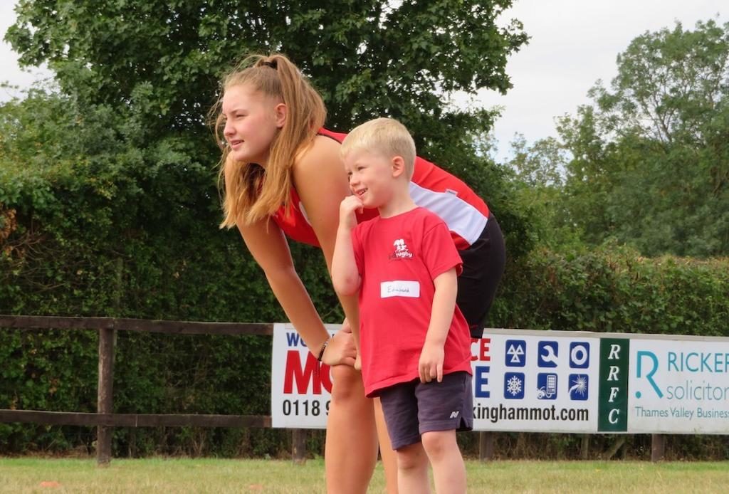 didi rugby coach Caitlin Clark with a young boy at a class