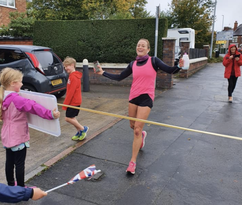 Vicky Macqueen goes through the finishing line after running a marathon