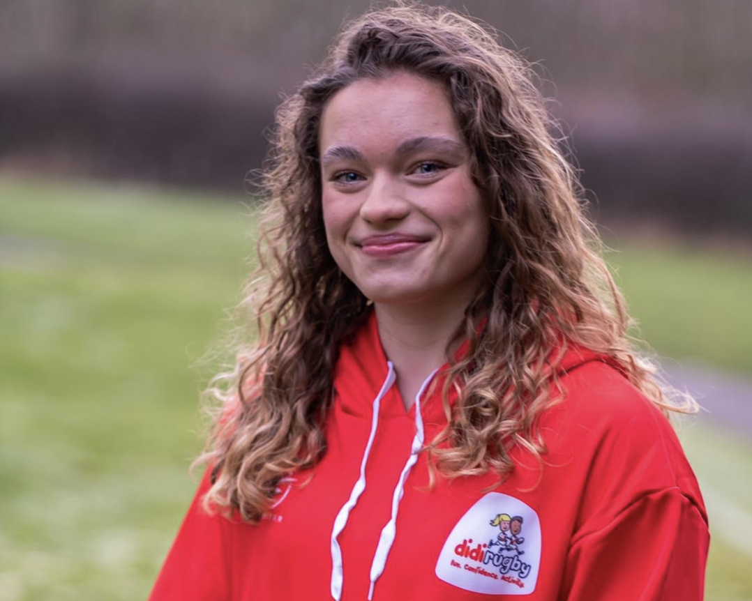 new didi rugby ambassador Jodie Ounsley wearing a red didi hoodie