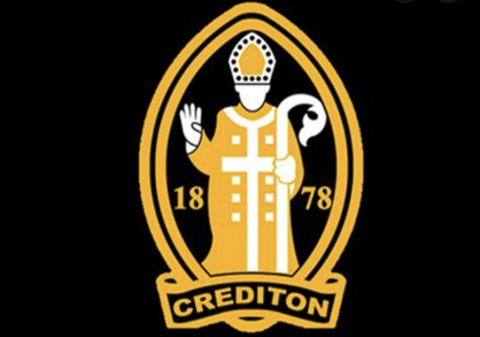 Crediton RFC logo shows a religious figure in yellow on a black background
