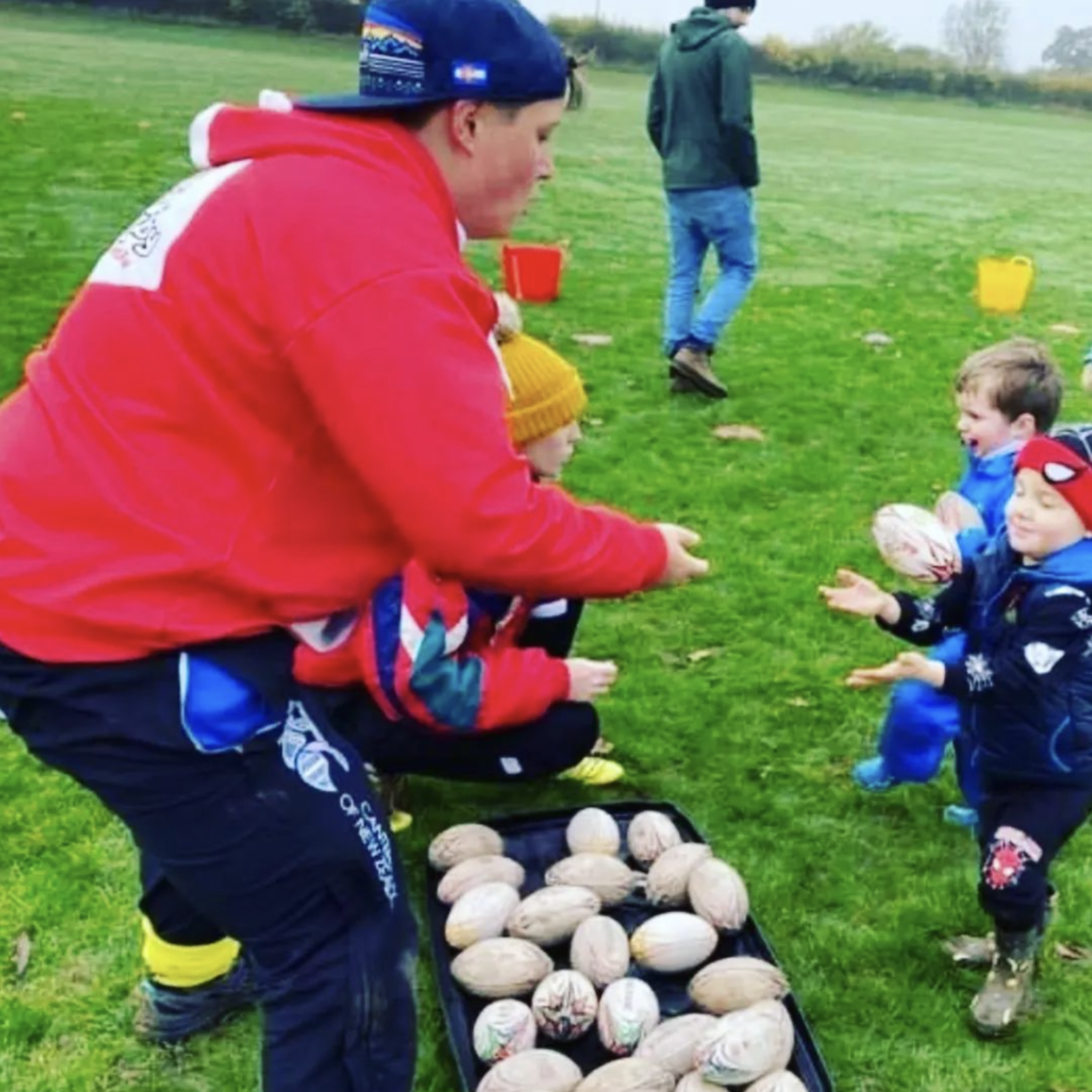 Ros Wiggins with children at a didi rugby session