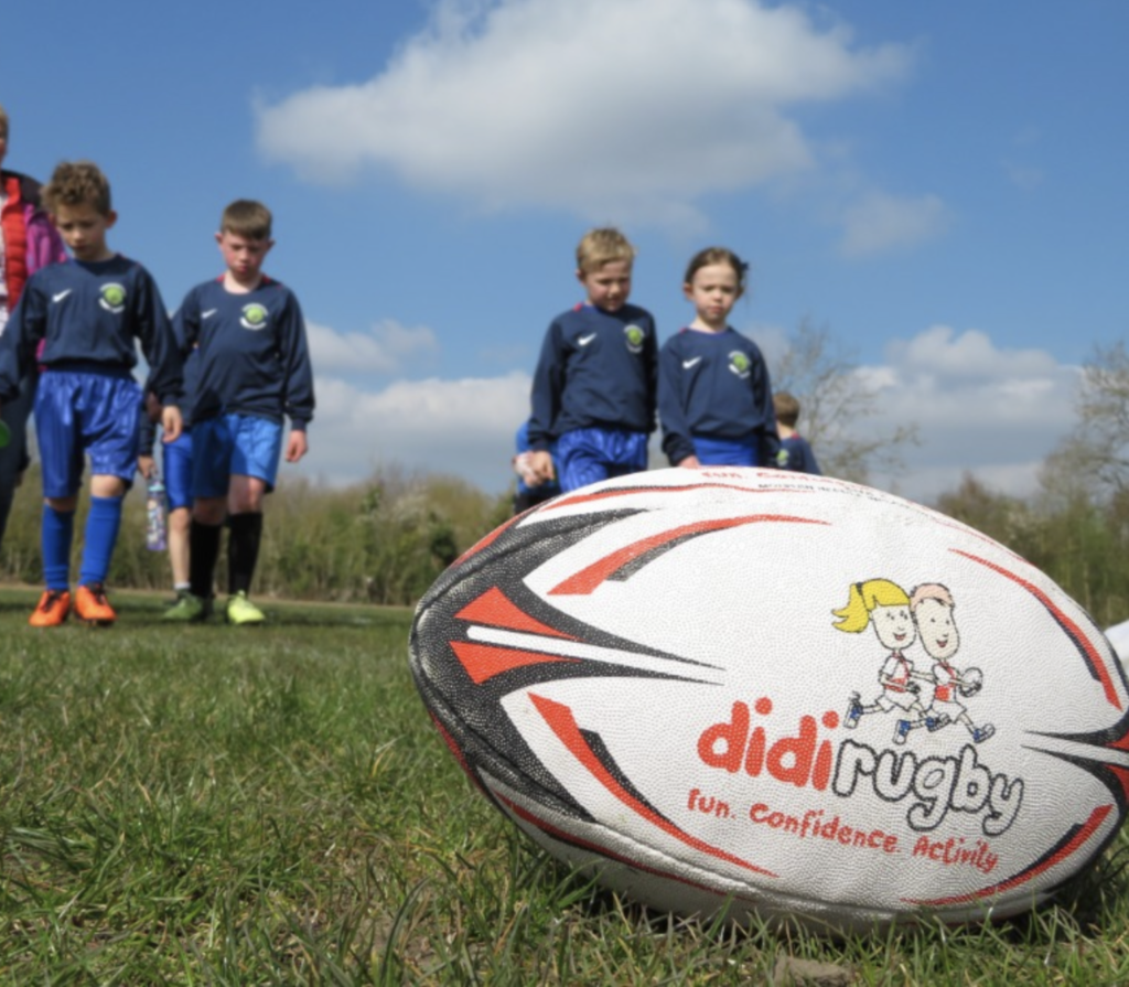 didi rugby ball on grass